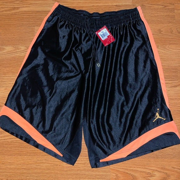 black and orange jordan shorts